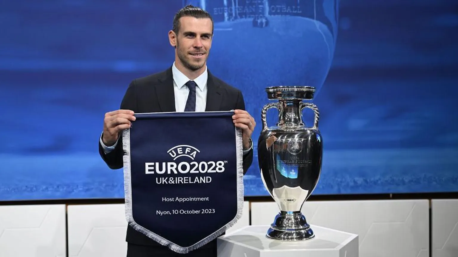 Betanon ja UEFA:n vuoden 2028 jalkapallon EM-turnauksen sponsorisopimusta kuvaava urheiluvedonlyönnin uutiskuvitus